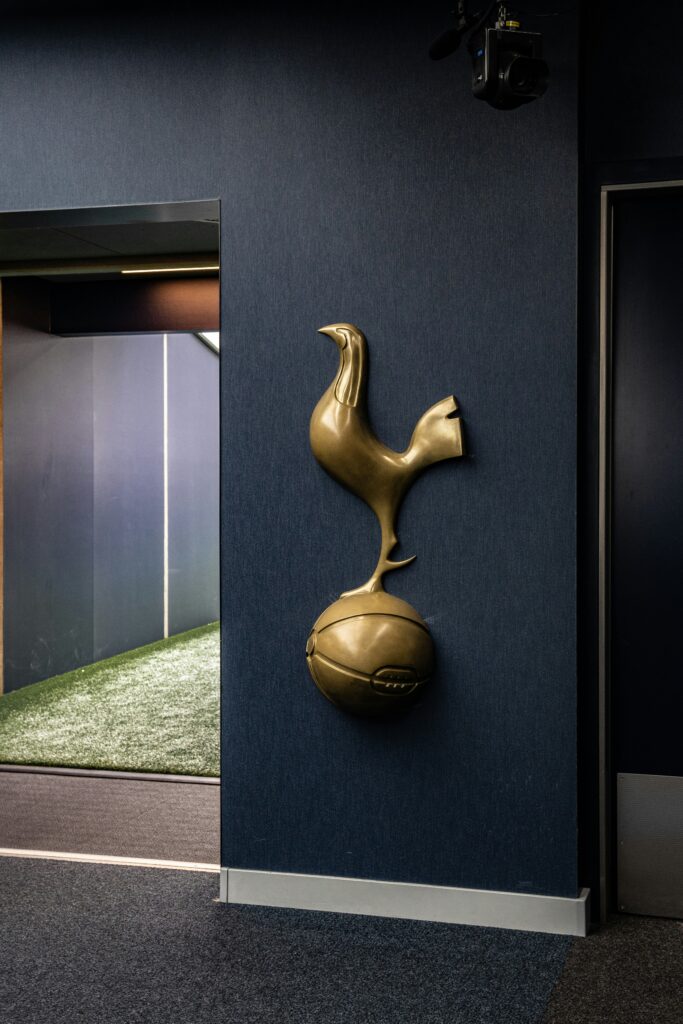 A Tottenham badge on the wall